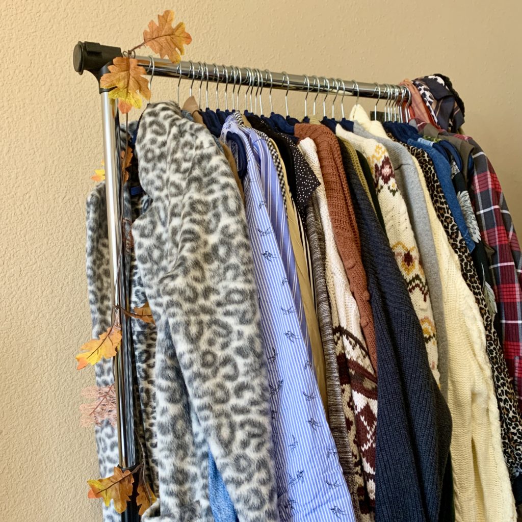 Garment rack with outerwear hanging on it