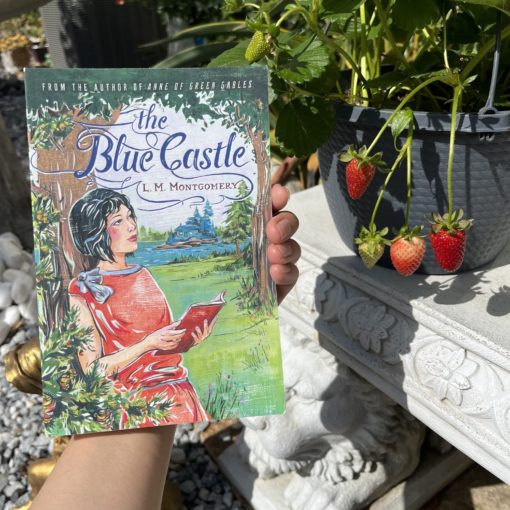 The Blue Castle next to strawberries